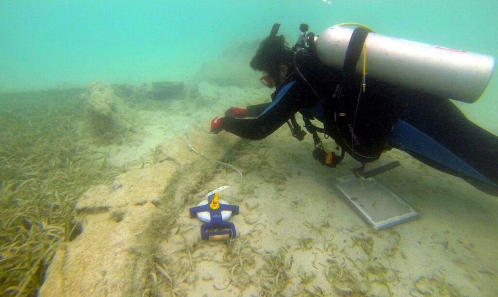 Deborah Moss scuba dives at the bottom of the ocean near Bermuda.