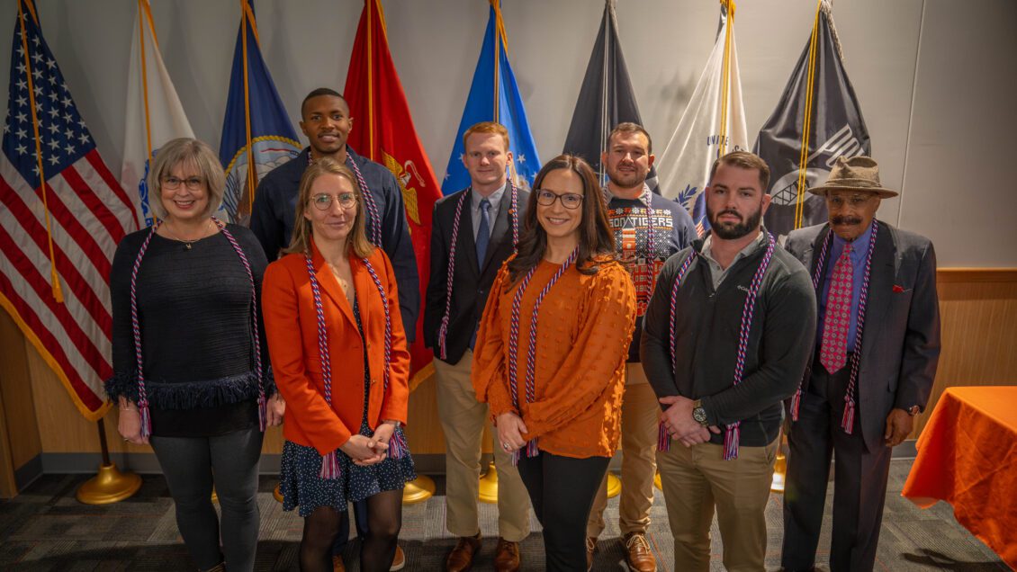 Class of 2023 military and veteran graduates receive red, white and blue Americana cords in honor of their December graduation from Clemson