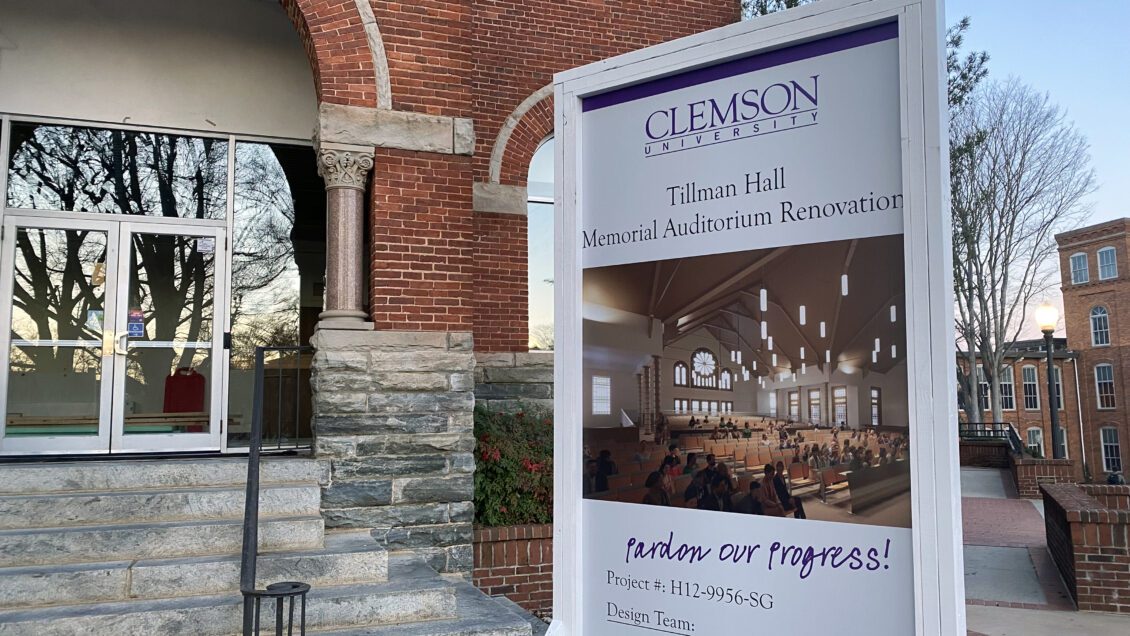 A sign outside of Tillman Hall's Memorial Auditorium showing a rendering of the completed renovations