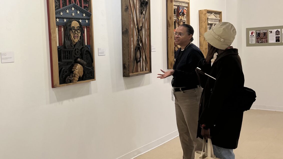 BFA Alumna, Felicia Gibbs Greenlee '93 describes her exhibition with a visitor