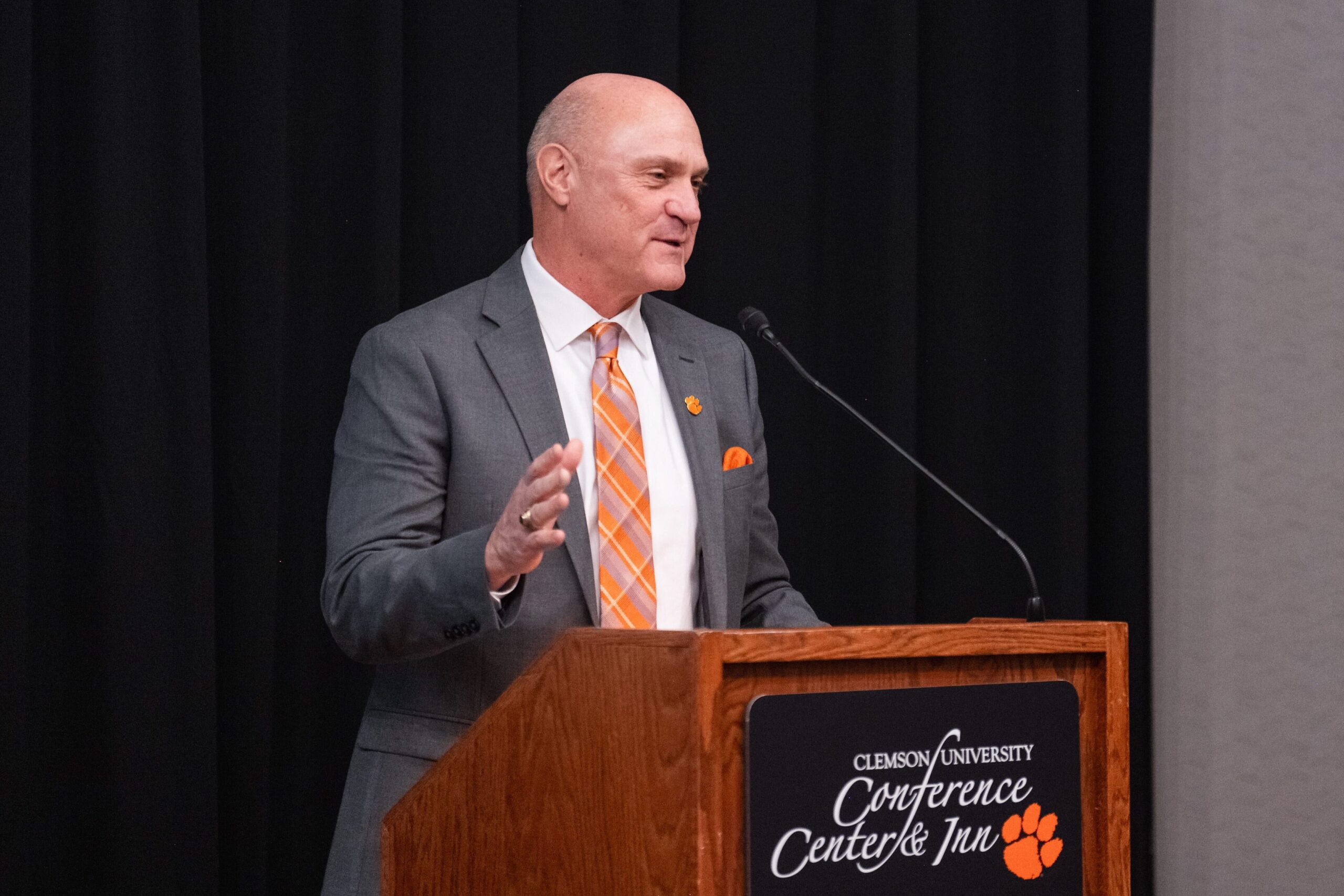 Clemson President Jim Clements speaks at a podium at the Madren Center.