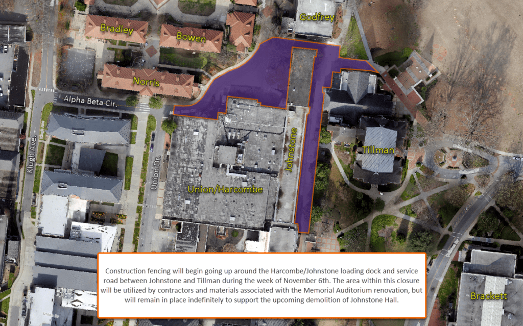 An aerial photograph of Clemson University buildings with an inset that reads "Construction fencing will begin going up around the Harcombe/Johnstone loading dock and service road between Johnstone and Tillman during the week of November 6th. The area within this closure will be utilized by contractors and materials associated with the Memorial Auditorium renovation, but will remain in place indefinitely to support the upcoming demolition of Johnstone Hall."