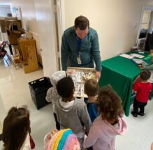 Ethan Cashwell of the Pickens County Library System talks with Pre-K students about insects that are native to South Carolina.