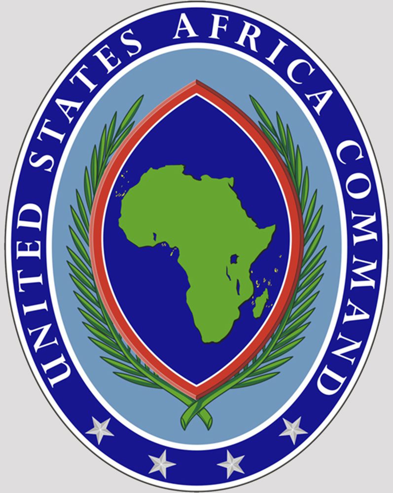 The insignia for the United States Africa Command, which consists of a green illustration of the African continent surrounded by a purple filled diamond with a red outline. 