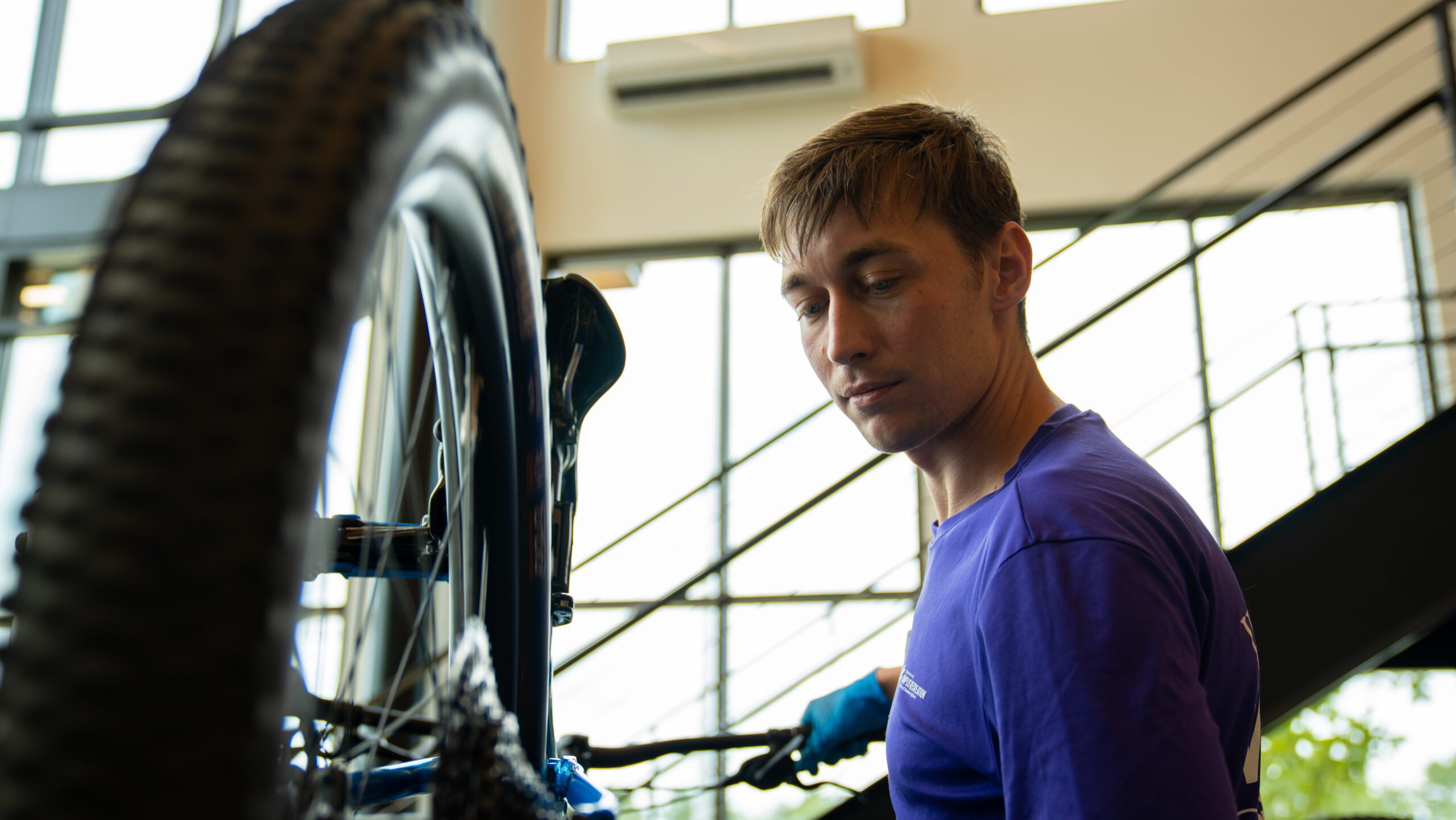 A student repairs a bike in Andy Quattlebaum Outdoor Education Center