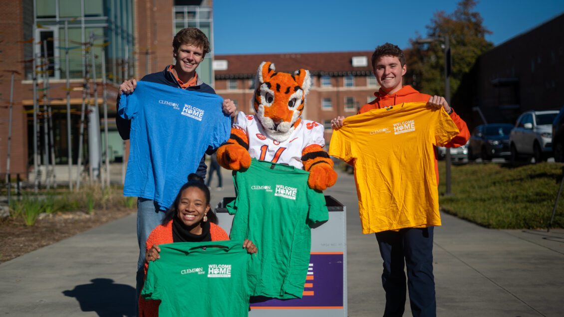 Ashley McCollum and Luke Hall with the Tiger Cub displaying move-in shirts