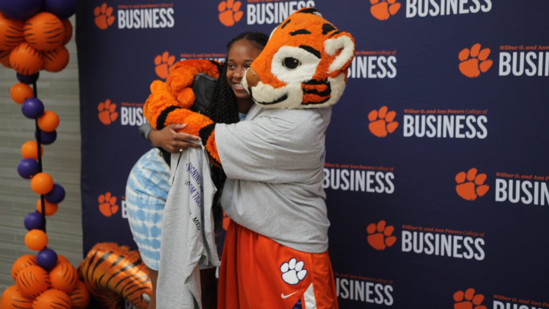 A student hugging the tiger at signing day.