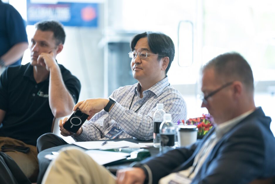 People sitting during the Global Tire Conference.