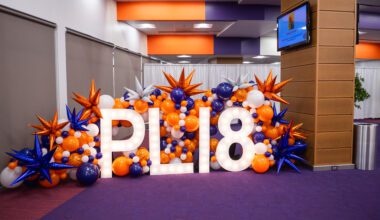 Balloon decorations mark the entryway of a graduation celebration. 