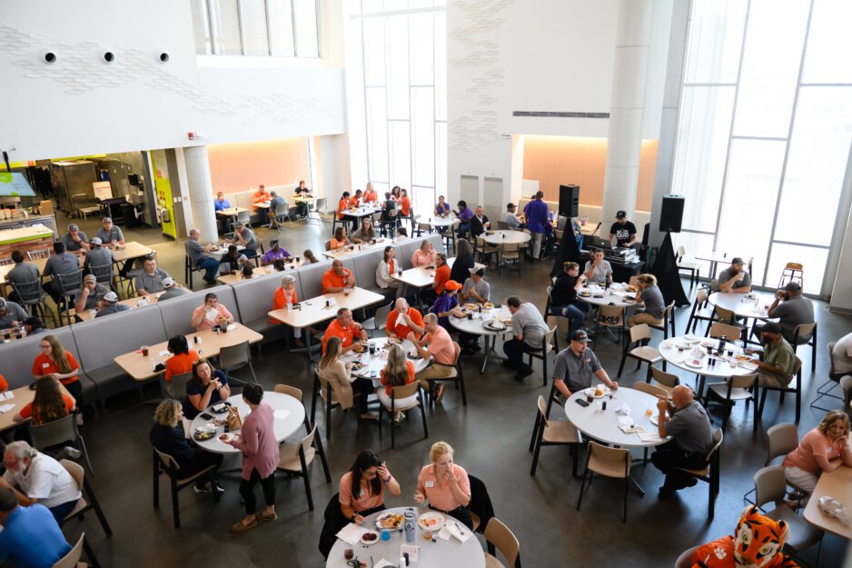 Individuals sit at tables in the Dish at McAlister Dining Hall.