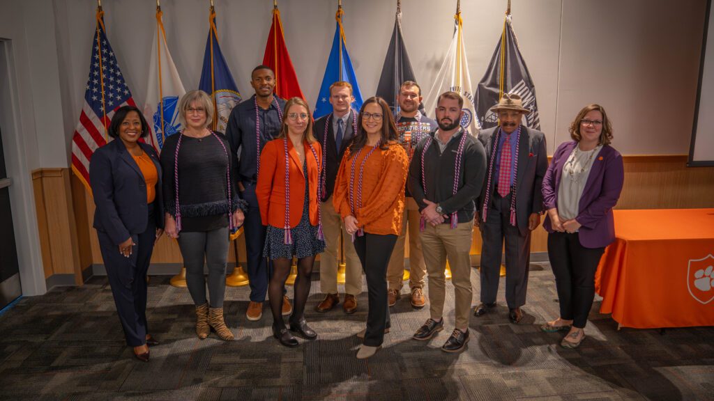 Kimberly Poole, Emily DaBruzzi and 2023 graduating student veterans