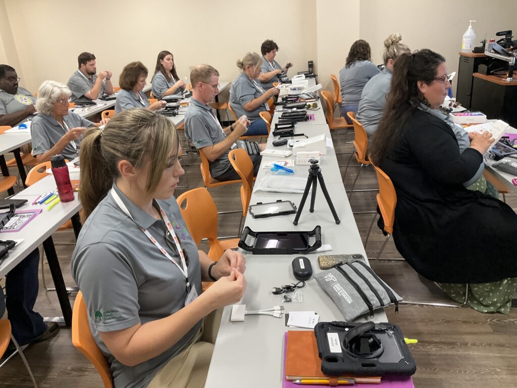 Stem it Up² agriscience teachers unboxing thier technology packages. (Photo: Kyleigh C. Hilburn/University of Florida)