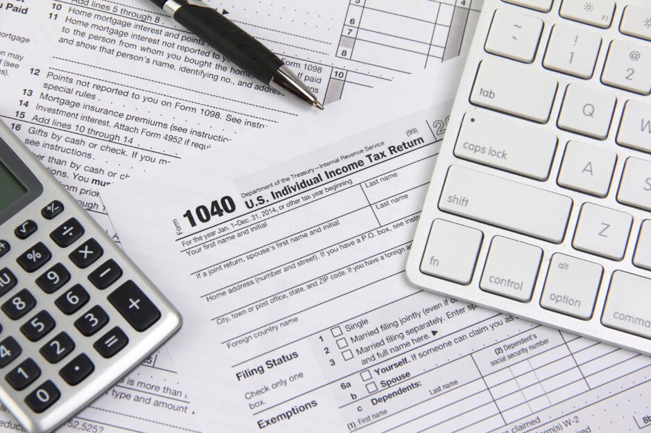 Technology and paperwork showing tax filing and tax preparation