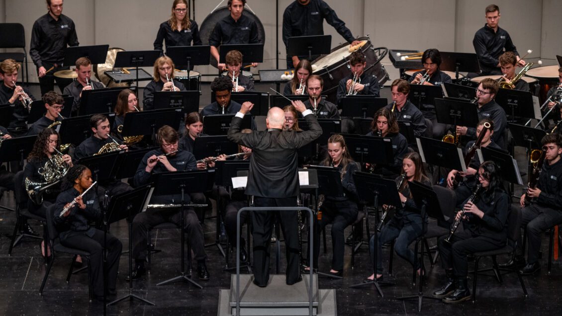 Professor Mark Spede conducts the Clemson University Symphonic Band on the Brooks Theatre stage.