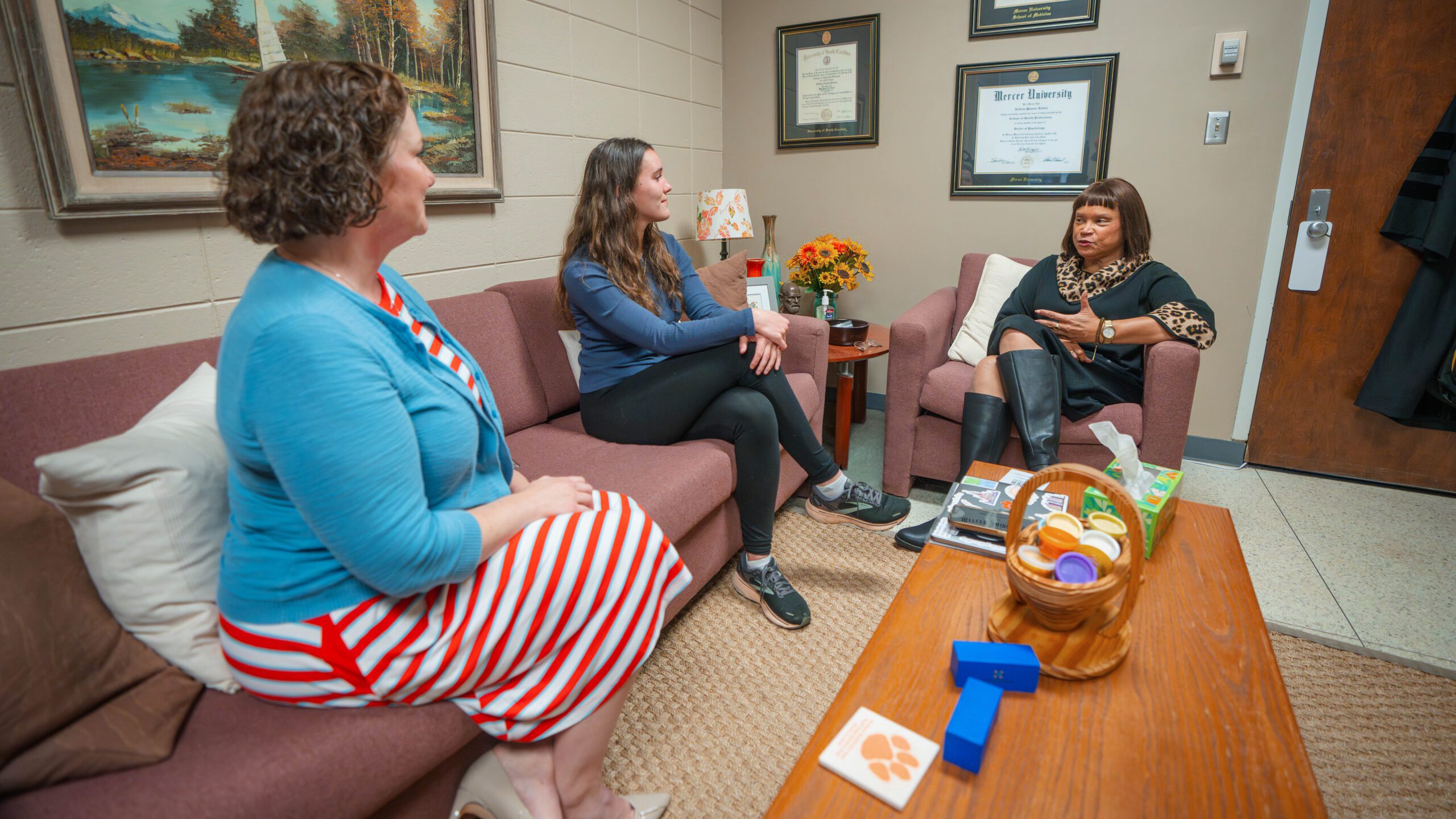 Andie Eaton and Debra Crisp of CAPS speak with a student