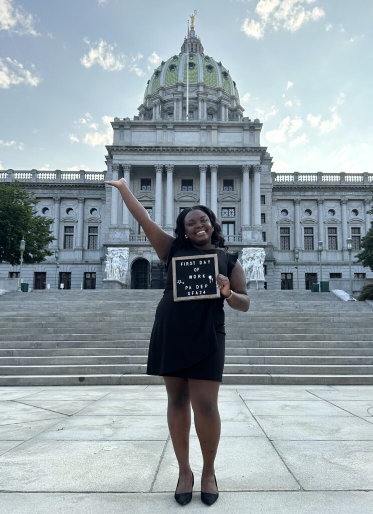 Imari Crumity in front of capitol building