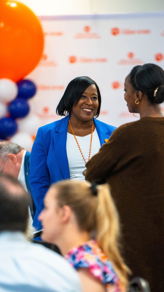 Kimberly Poole talking to a staff member in Student Affairs