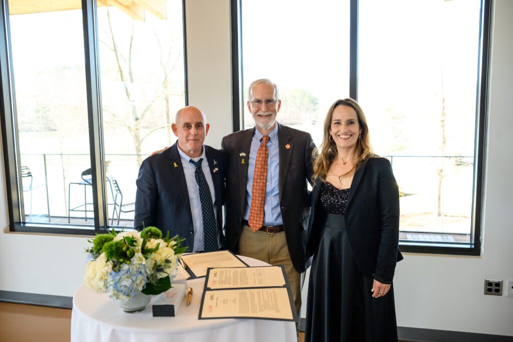 Hebrew University dean Saul Burdman and Sapir College dean Gail Gilboa-Freedman join Clemson Provost Bob Jones in signing a Memorandum of Understanding acknowledging a partnership between the three institutions.