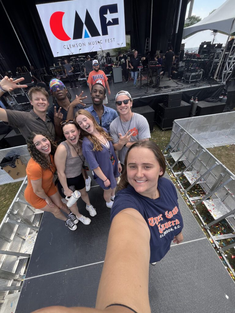 Abby Szlosek and members of the student marketing team take a selfie following Clemson Music Fest 2024