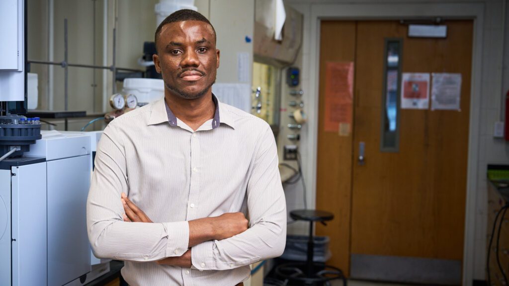 Samuel Kwain, poses for a photo in his lab.