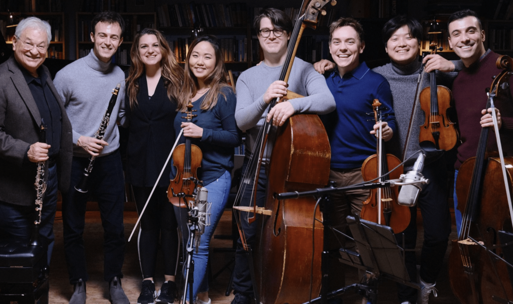 Soloists smile and pose with their instruments