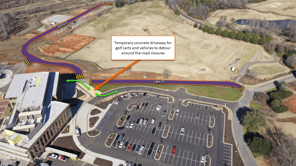 A rendering of a parking lot with green arrows indicating a temporary golf cart path. Text reads "Temporary concrete driveway for golf carts and vehicles to detour around the road closures."
