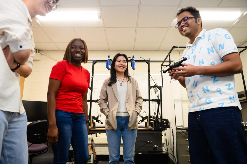 Li (second from left) works in her McAdams Hall lab with graduate students.