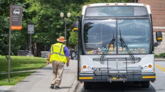 A transit bus stops on main campus