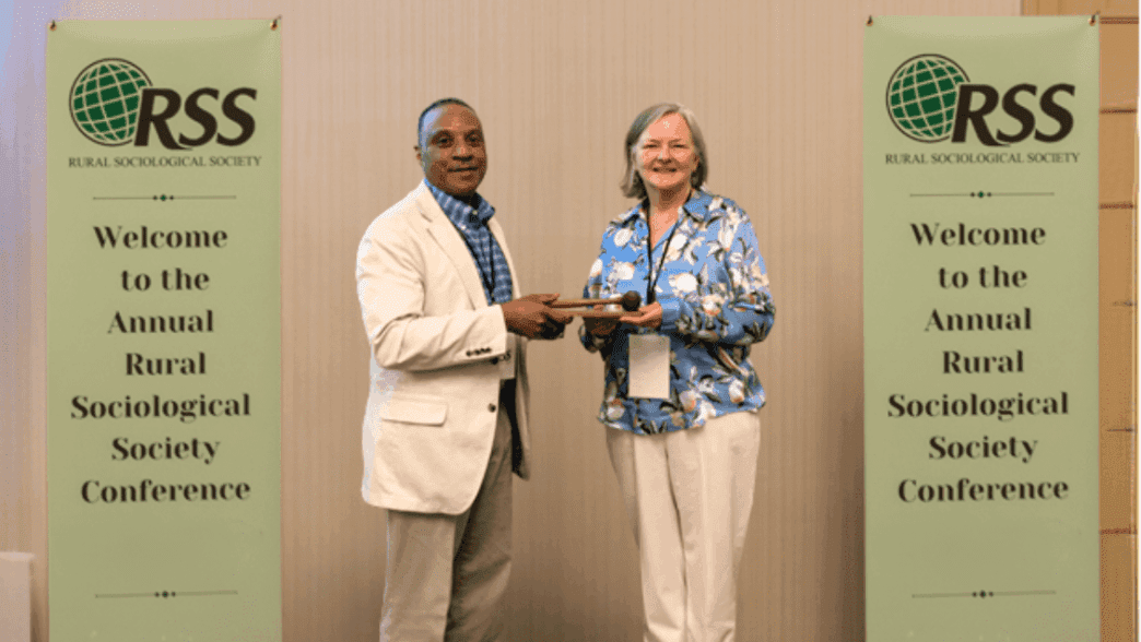 Associate Professor Ken Robinson passes gavel to new RSS president