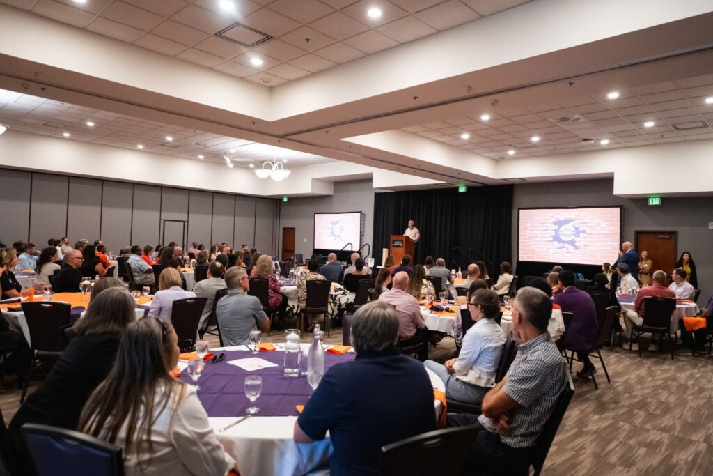Max Allen addresses a large crowd.