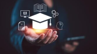 An artist illustration showing a hand with a graduation cap and a book, a computer screen, and a brain to represent an AI-assisted virtual teaching assistant.