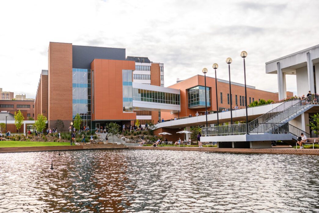 Students walk across library bridge on Clemson's campus