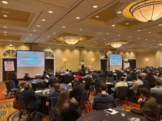 A ballroom filled with people at the 10th annual Construction Symposium