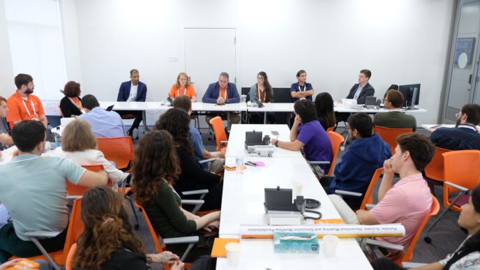Speakers at HPC Day at Clemson present to an audience in a classroom.