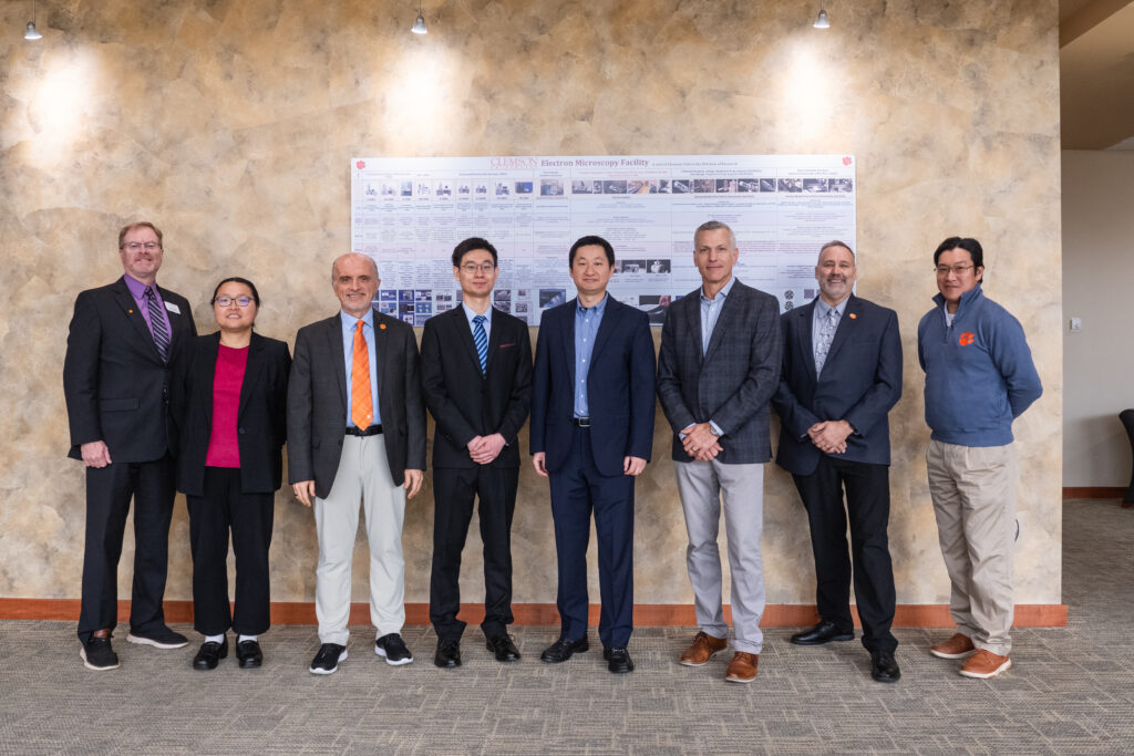 eight people posing for a photo