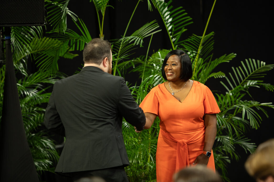 Associate Vice President and Dean of Students Kimberly Poole shakes the hand of a student at the Fall 2025 Ring Ceremony