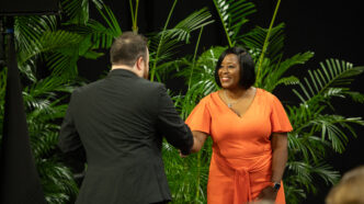 Associate Vice President and Dean of Students Kimberly Poole shakes the hand of a student at the Fall 2025 Ring Ceremony