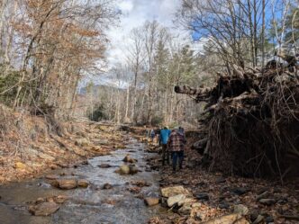 Clemson scientists walking along Tropical Helene storm damage in North Carolina.