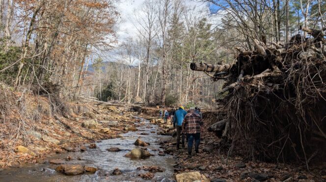 Clemson scientists walking along Tropical Helene storm damage in North Carolina.