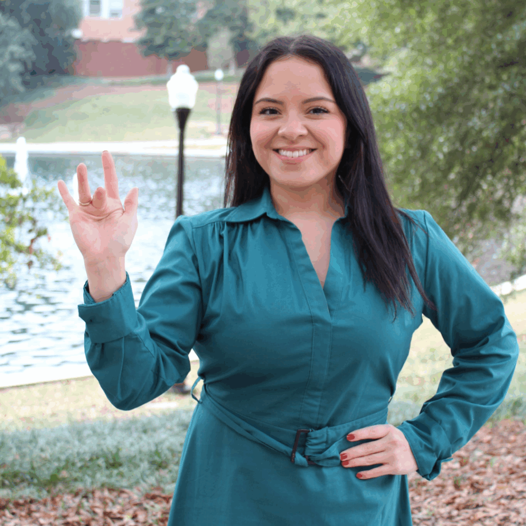 Jennifer Garcia doing the sign for "25" in American Sign Language.