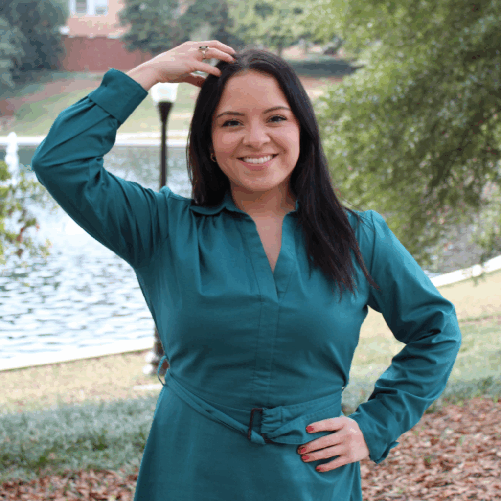 Jennifer Garcia doing the sign for "Clemson" in American Sign Language.