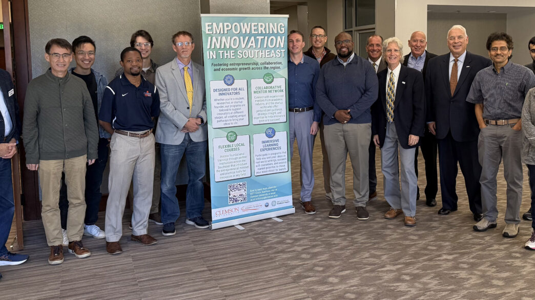 16 people posing for a group photo