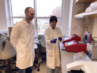 Clemson University scientists Alexis “Stocko” Stamatikos and Jing “Jennifer” Echesabal-Chen prepare to use a thermocycler, a machine that amplifies DNA, to confirm the genetic makeup of immune cells called macrophages.