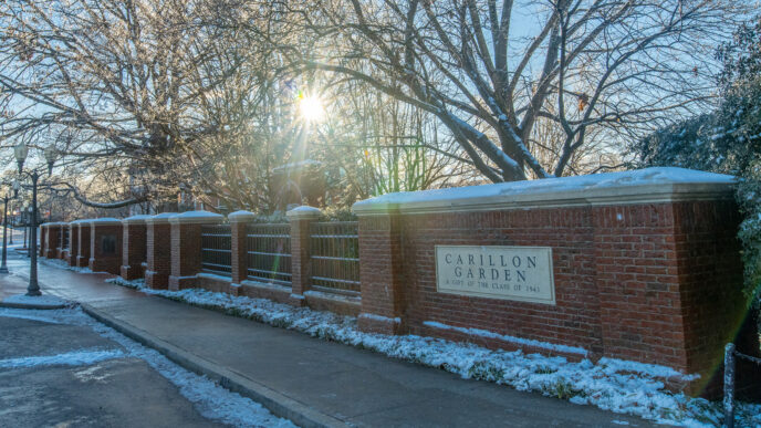 The sun rises over Carillon Garden the morning after a snowstorm on campus.