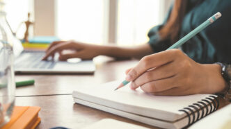 Writing in a notebook