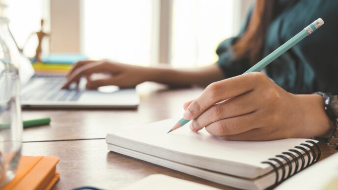 Writing in a notebook