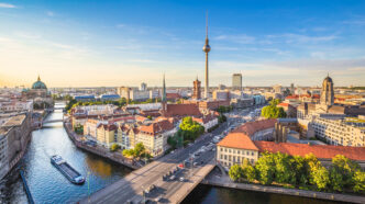 Berlin skyline panorama with TV tower and Spree river at sunset