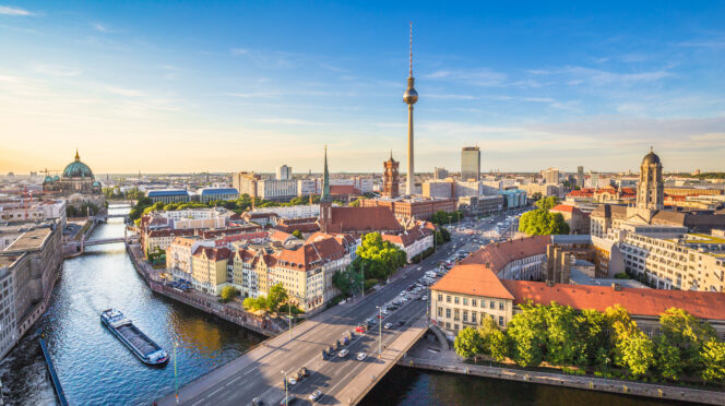 Berlin skyline panorama with TV tower and Spree river at sunset