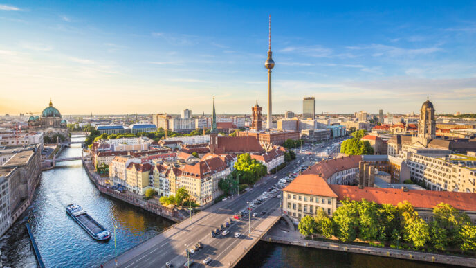 Berlin skyline panorama with TV tower and Spree river at sunset