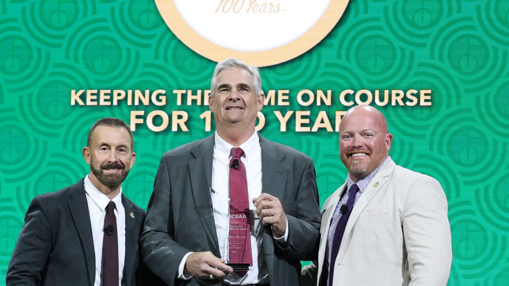 Lambert "Bert" McCarty (center), Clemson professor emeritus, receives the GCSAA Outstanding Contribution award from Rhett Evans (left), GCSAA chief executive officer and T.A. Barker, GCSAA president.
